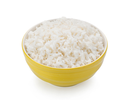rice in yellow bowl on white backgroundの写真素材