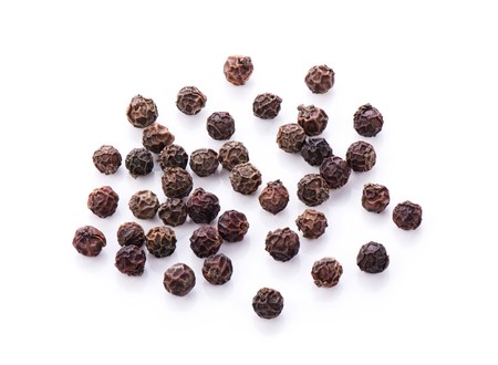Black Peppercorns isolated on white backgroundの写真素材