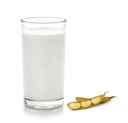 glass of milk and soy bean on white backgroundの写真素材