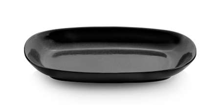 black plate isolated on white backgroundの写真素材