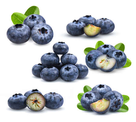 set of blueberries with green leaves closeup, isolated on white backgroundの写真素材
