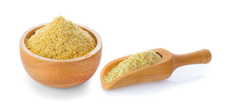 Wheat germ in wood bowl and scoop isolated on white backgroundの写真素材
