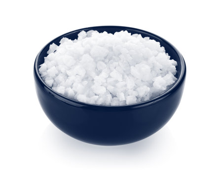salt in a bowl isolated on white backgroundの写真素材