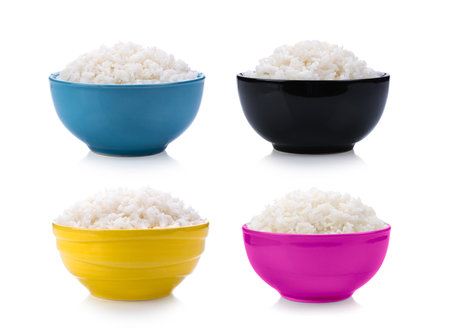 Rice in bowl isolated on white backgroundの写真素材