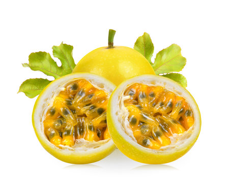 yellow passion fruit with leaf isolated on white backgroundの写真素材
