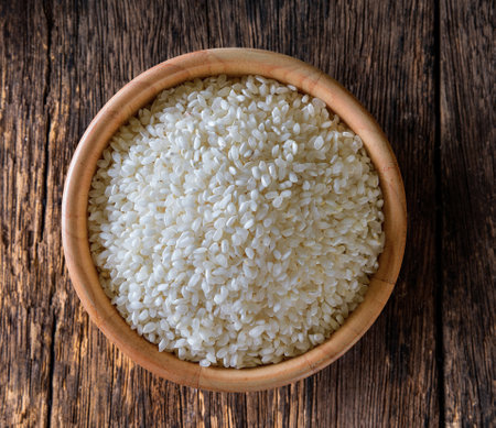 rice in  bowl on wooden tableの写真素材