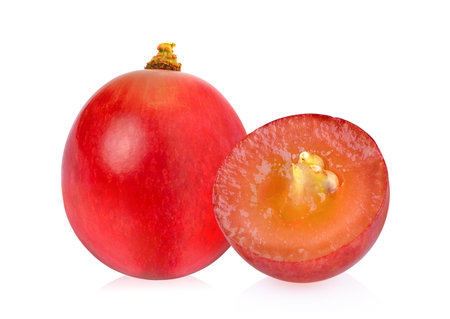 Ripe red grape isolated on white backgroundの写真素材
