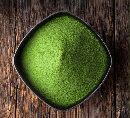 green tea powder in a bowl on tableの写真素材
