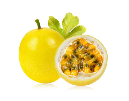 yellow passion fruit with leaf isolated on white backgroundの写真素材