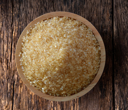 sugar in wood bowl on woodの写真素材