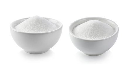 sugar in white bowl isolated on white backgroundの写真素材