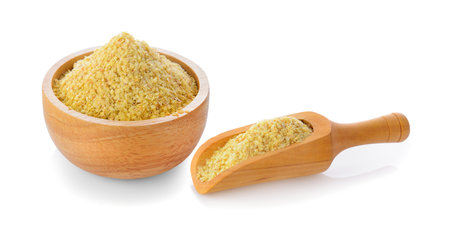 Wheat germ in wood bowl on white backgroundの写真素材