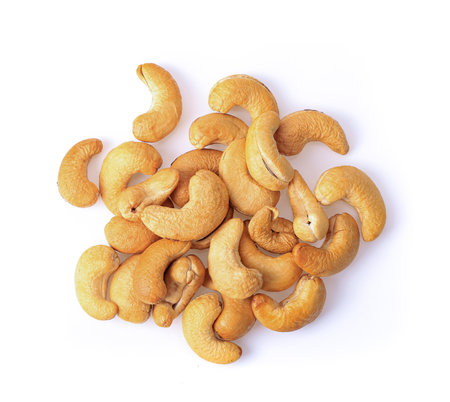 Roasted Cashew nuts isolated on white backgroundの写真素材