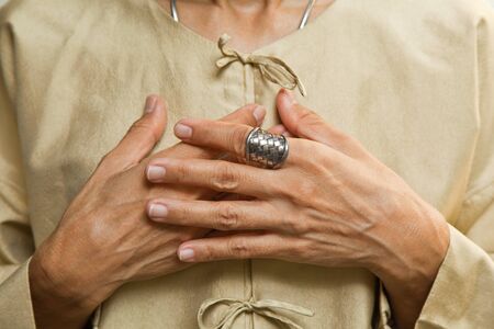 SILVER RING ON A THAI SILK BLOUSE の写真素材