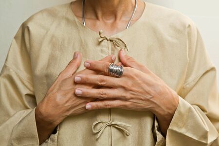 SILVER RING ON A THAI SILK BLOUSE の写真素材