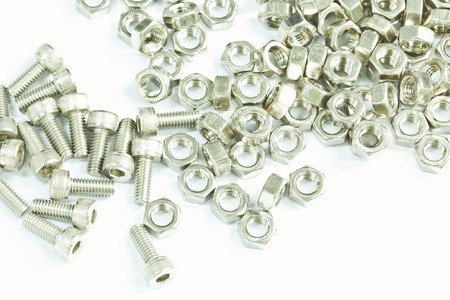 Group of bolts and nuts isolated on whiteの写真素材