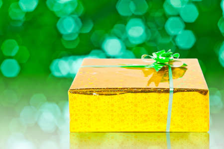 Gift giving on green backgroundの写真素材