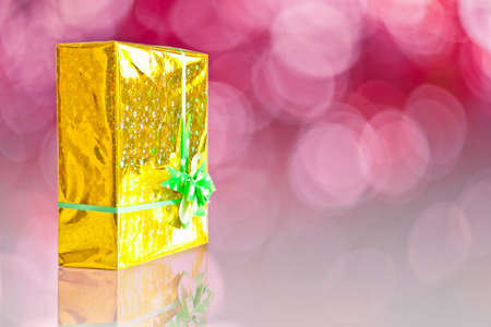 Gift giving on red backgroundの写真素材