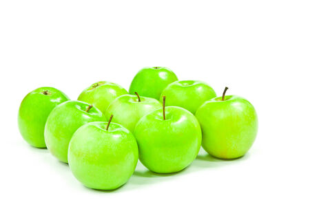 Green apples isolated on whiteの写真素材