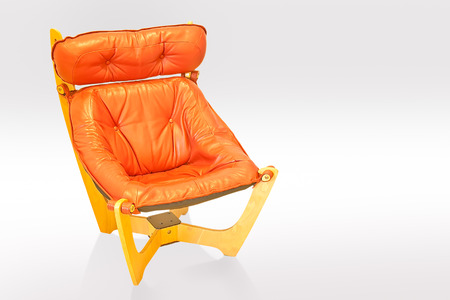 Orange leather chair isolated on whiteの写真素材