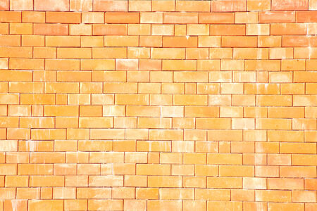 The pattern of yellow brick wallの写真素材