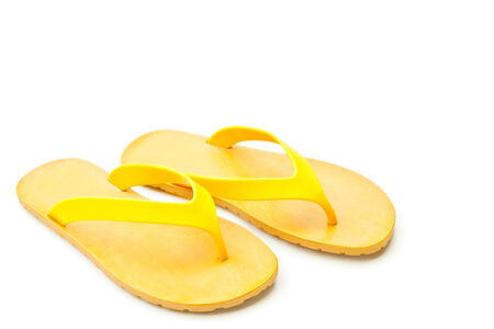 Yellow slippers isolated on whiteの写真素材