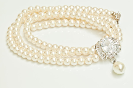 Diamond and pearl necklace isolated on whiteの写真素材