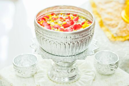 Silver bowl with many flower, This holy water use on Thailand New Year Songkran Water Festivalの写真素材