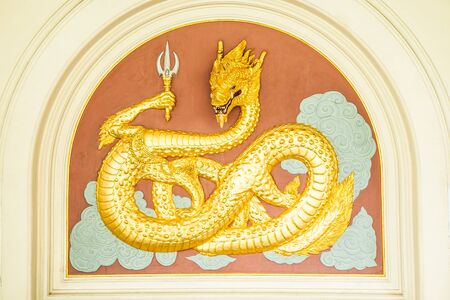 Gold dragon on the wall