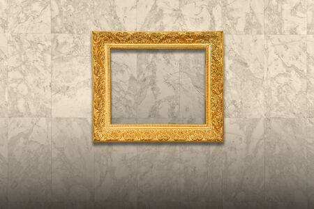 Antique old picture frame on marble wallの写真素材