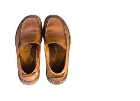 Old brown leather men's shoes isolated on white