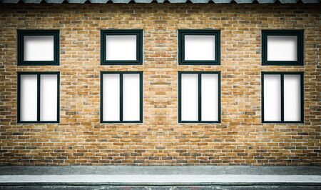 Yellow brick wall and light windowsの写真素材