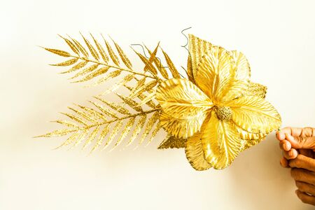Golden fabric flowers isolated on white, Backgroundsの写真素材