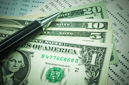 United States Dollar on passbook and a penの写真素材
