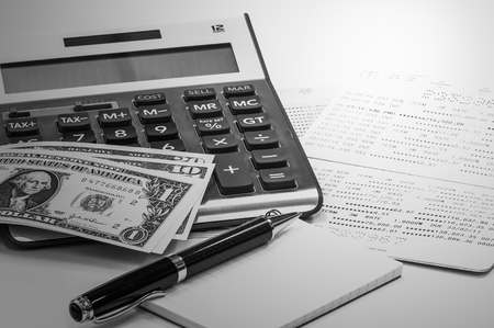 Pen and notebook, Thai banknote, saving account passbook and calculatorの写真素材