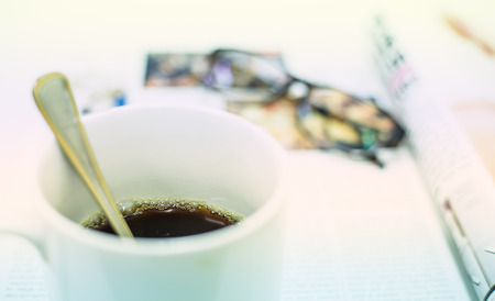 Cup of coffee, Magazine and Glasses Backgroundの写真素材