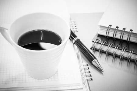 Notebook with elegant pen and cup of hot coffee, Backgroundsの写真素材