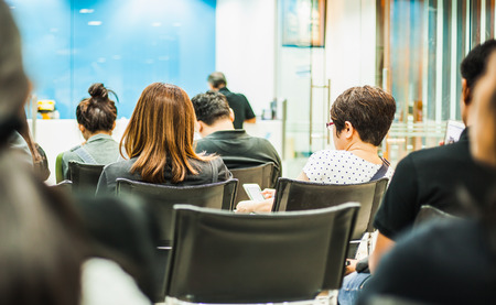 Bank customers are sitting and wait at the queue card, Backgroundsの写真素材