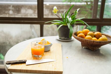Oranges are squeezed by hand to make a pure and healthy orange juice, 100 percent of natural, and fresh full of vitaminsの写真素材