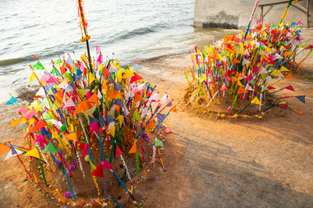 A colorful flags on sandy pagoda in Thai Songkran Festival, Thailandの写真素材