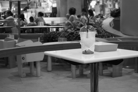 A drink on the table in the food court at Central Bangna Bangna-Trad Road, Bangkok, Thailandの写真素材