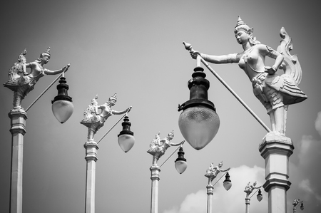 Street Lamp, Mythical female bird with a human head, Kinnaree and blue skyの写真素材