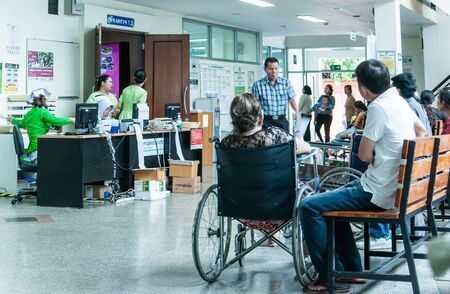 Patients were seats waiting room to receive treatment from a doctor, Backgrounds in hospital at Kluaynamthai hospital Rama 4 road Bangkok Thailand, December 29, 2000のeditorial素材