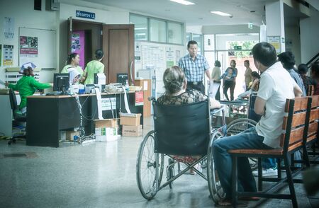 Patients were seats waiting room to receive treatment from a doctor, Backgrounds in hospital at Kluaynamthai hospital Rama 4 road Bangkok Thailand, December 29, 2000のeditorial素材
