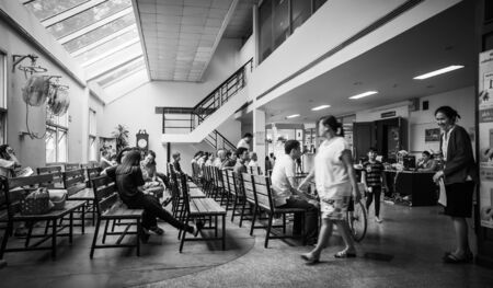Patients were seats waiting room to receive treatment from a doctor, Backgrounds in hospital at Kluaynamthai hospital Rama 4 road Bangkok Thailand, December 29, 2000のeditorial素材