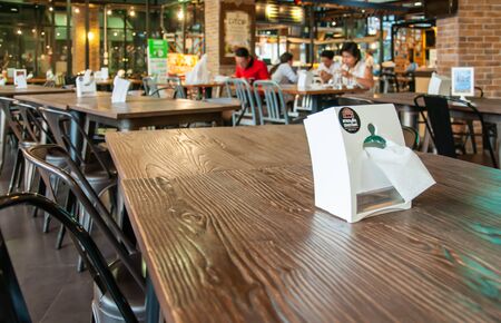 Tissue box on table and food court interior in Suan Plern Shopping Mall, There are a lot of cafes and restaurants at Rama 4 road Klong Toey Bangkok Thailand,  December 29, 2000のeditorial素材