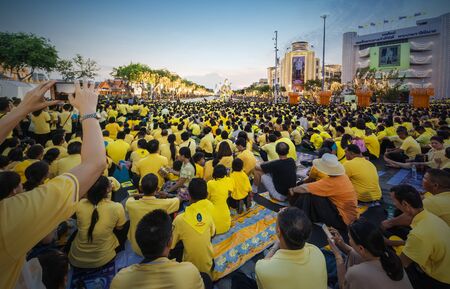 Thai people wear yellow shirts and are waiting for His Majesty King Rama 10 through Ratchadamnoen...