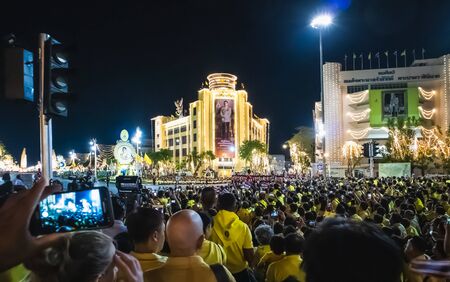 Thai people wear yellow shirts and are waiting for His Majesty King Rama 10 through Ratchadamnoen...