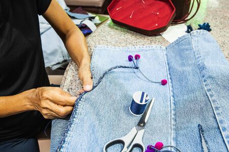 Women were sewing shirts in the house, Backgroundsの写真素材