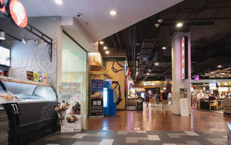 People eating and drinking in food court at Terminal 21 Asoke Montri Intersection Sukhumvit road...